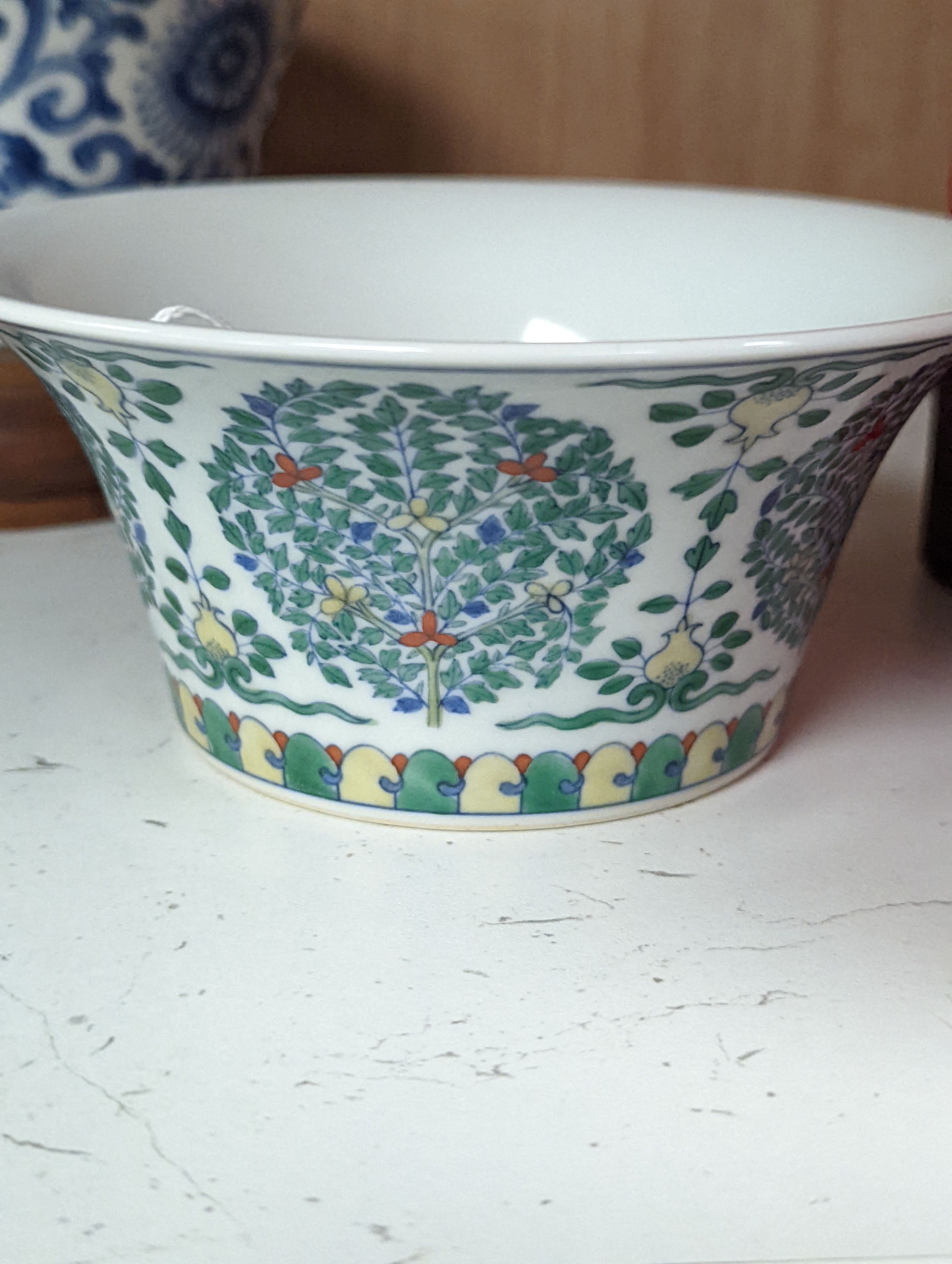 A Chinese blue and white bowl, Kangxi, 15cm. diam., a famille rose teapot stand, Yongzheng, and two doucai bowls